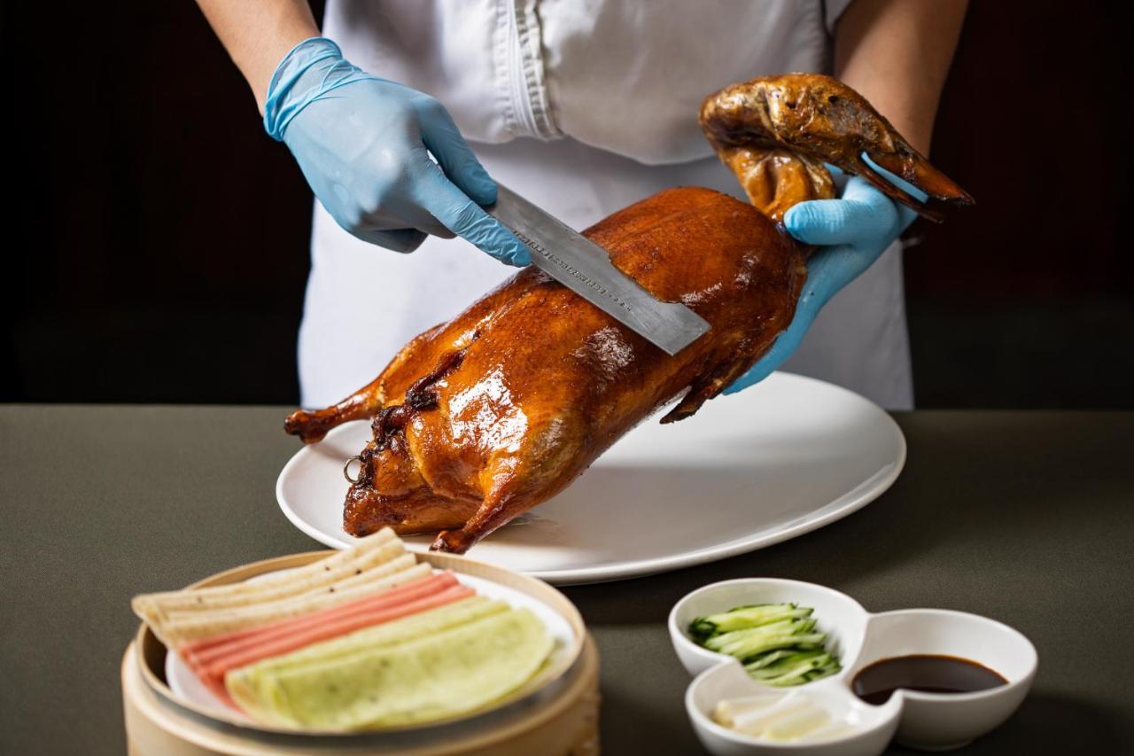 Ambassador Hotel Hsinchu Exteriör bild Peking duck being prepared
